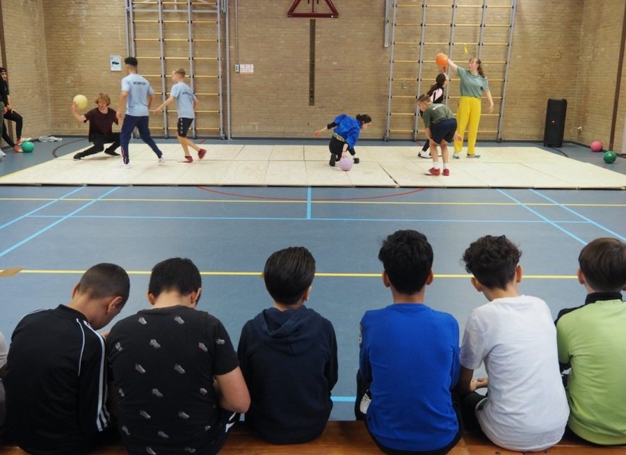 kids watching and performing sports activities