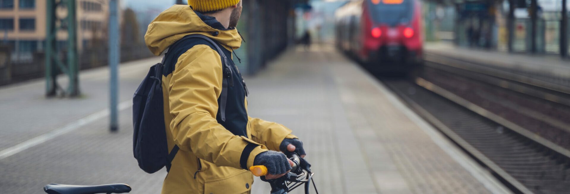 man with bike waiting for the train